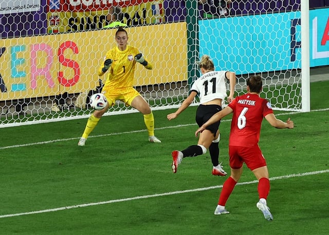 Soccer Football - Women's Euro 2025 - Group C - Germany v Poland - Arena St. Gallen, St. Gallen, Switzerland - July 4, 2025 Germany's Lea Schuller scores their second goal past Poland's Kinga Szemik REUTERS/Bernadett Szabo