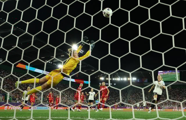 Soccer Football - Women's Euro 2025 - Group C - Germany v Poland - Arena St. Gallen, St. Gallen, Switzerland - July 4, 2025  Germany's Jule Brand scores their first goal past Poland's Kinga Szemik REUTERS/Denis Balibouse