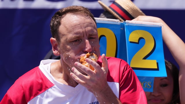 Joey Chestnut competes in the men’s competition at Nathan’s Annual Hot Dog Eating Contest on July 4, 2025 in New York City. 