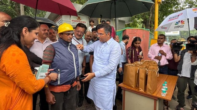 PWD minister Parvesh Verma distributing cooling jackets to field staff on Friday. (HT PHOTO)