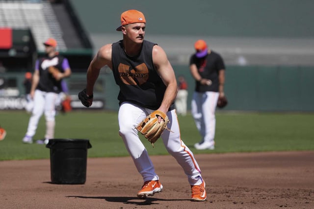 Injured San Francisco Giants third baseman Matt Chapman fields ground balls before a baseball game between the Giants and the Cleveland Guardians in San Francisco, Tuesday, June 17, 2025.