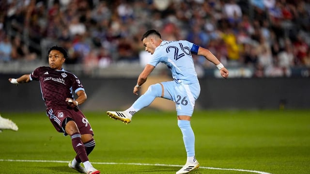 Sporting Kansas City midfielder Erik Thommy (26) shoots past Colorado Rapids defender Jackson Travis (99) in the second half at Dick’s Sporting Goods Park on July 4, 2025.