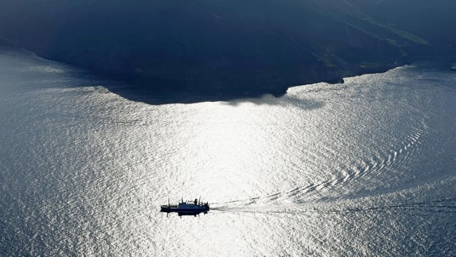 An aerial view shows a ferry carrying residents and visitors evacuating from Akuseki Island, as multiple earthquakes hit the island in Japan.