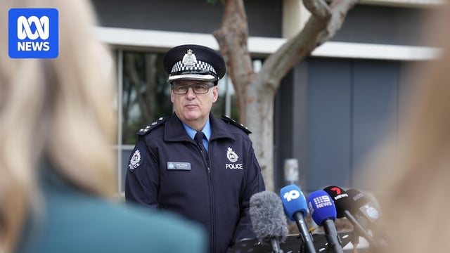 Mike Peters wears his police uniform pictured outside headquarters at a press conference