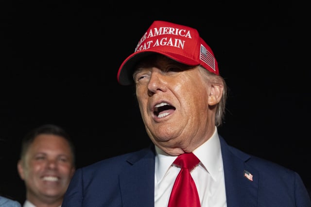 President Donald Trump speaks with reporters as he arrives on Air Force One, Friday, July 4, 2025, at Joint Base Andrews, Md.