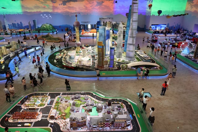 People visit Legoland Shanghai Resort on its grand opening day amid an orange alert for heat in Shanghai, China July 5, 2025. REUTERS/Go Nakamura