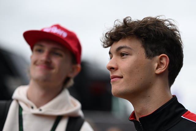 Formula One F1 - British Grand Prix - Silverstone Circuit, Silverstone, Britain - July 5, 2025 Haas' Oliver Bearman takes photographs with fans ahead of practice REUTERS/Jaimi Joy