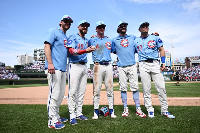 CHICAGO, ILLINOIS - JULY 04: The five players that hit home runs, Carson Kelly #15, Michael Busch #29, Pete Crow-Armstrong #4, Dansby Swanson #7, and Seiya Suzuki #27 of the Chicago Cubs, pose for a photo against the St. Louis Cardinals after the game at Wrigley Field on July 04, 2025 in Chicago, Illinois.