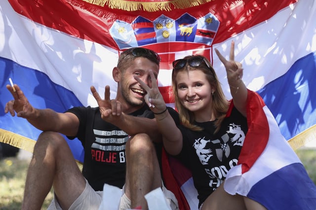 Fans pose prior to the concert of right-wing singer Marko Perkovic, known as Thompson, in Zagreb, Croatia, Saturday, July 5, 2025. (AP Photo)