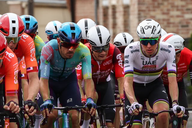 XDS Astana Team&#39;s Italian rider Davide Ballerini (C) and UAE Team Emirate - XRG team&#39;s Slovenian rider Tadej Pogacar (R) cycle with the pack of riders (peloton) during the 1st stage of the 112th edition of the Tour de France cycling race, 184.9 km starting and finishing in Lille Metropole, northern France, on July 5, 2025.