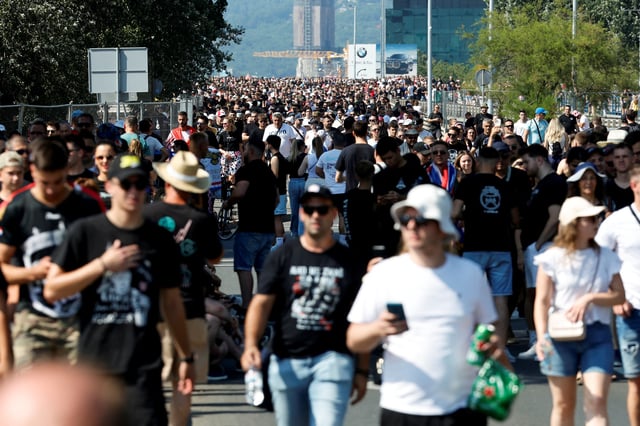 People arrive ahead of the concert of the Croatian singer Marko Perkovic Thompson, which is poised to break the world record for largest paid concert in Zagreb, Croatia, July 5, 2025. REUTERS/Borut Zivulovic