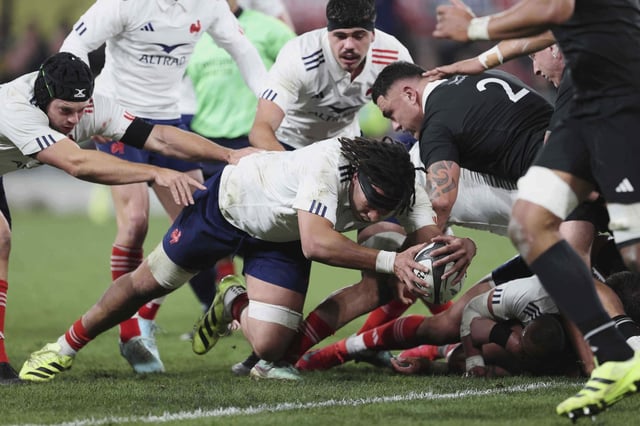 Mickael Guillard of France dives over to score their first try against the All Blacks in Dunedin, New Zealand, Saturday, July 5, 2025. (Peter Meecham/Photosport via AP)