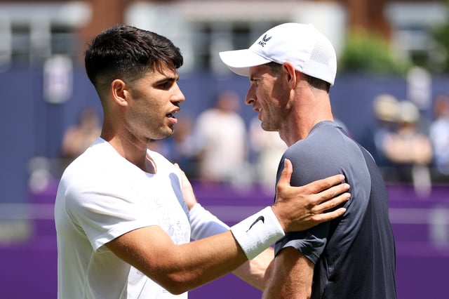 Carlos Alcaraz of Spain shakes hands with Andy Murray of Great Britain during practice on Day One of the cinch Championships at The Queen&#39;s Club on June 17, 2024 in London, England.
