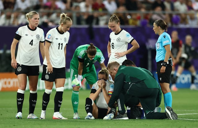 Soccer Football - Women's Euro 2025 - Group C - Germany v Poland - Arena St. Gallen, St. Gallen, Switzerland - July 4, 2025 Germany's Giulia Gwinn receives medical attention after sustaining an injury REUTERS/Stephane Mahe