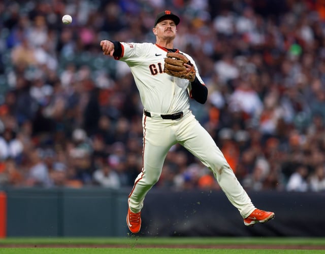 San Francisco Giants’ Matt Chapman (26) throws to first on a ball hit by San Diego Padres’ Fernando Tatis Jr. (23) in the fifth inning at Oracle Park in San Francisco, Calif., on Wednesday, June 4, 2025. Tatis Jr. was safe at first. (Nhat V. Meyer/Bay Area News Group)