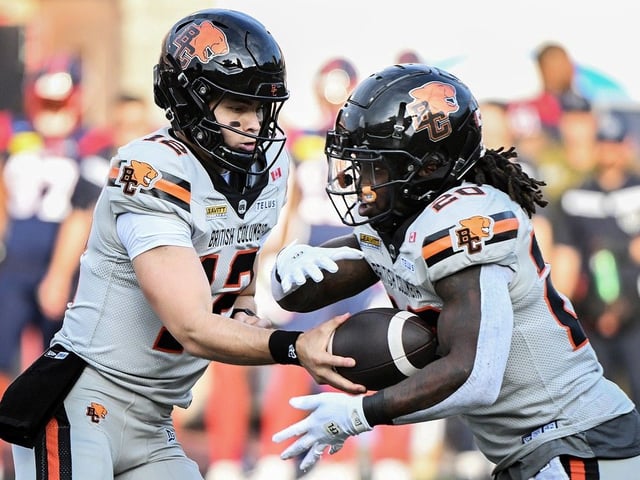 B.C. Lions quarterback Nathan Rourke hands off to James Butler during first half of game against the Montreal Alouettes in Montreal, Saturday, July 5, 2025.
