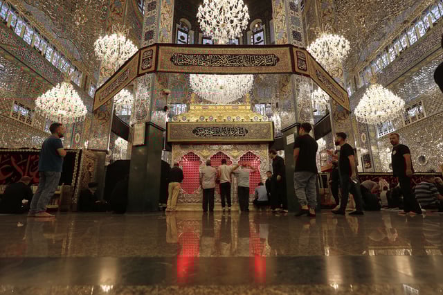 Shiite worshippers pray at the shrine of al-Sayydah Zeinab, the grand daughter of Prophet Mohammed, where they attend Ashoura ritual, south of Damascus, Syria, Thursday, July 3, 2025. (AP Photo/Omar Sanadiki)