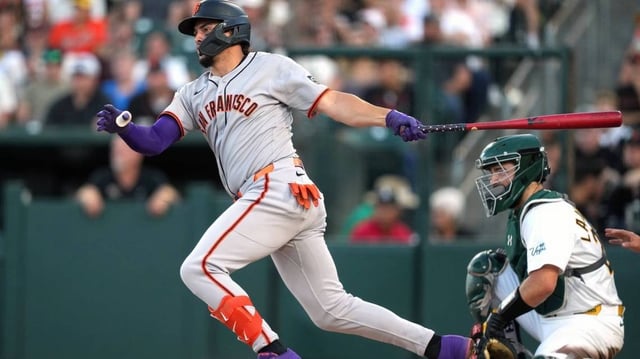 Jul 5, 2025; West Sacramento, California, USA; San Francisco Giants shortstop Willy Adames (2) hits an RBI single against the Athletics during the third inning at Sutter Health Park. Mandatory Credit: Darren Yamashita-Imagn Images