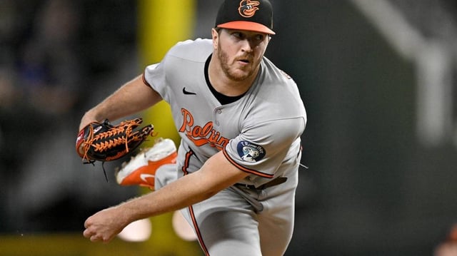 Jun 30, 2025; Arlington, Texas, USA; Baltimore Orioles starting pitcher Trevor Rogers (28) pitches against the Texas Rangers during the first inning at Globe Life Field. Mandatory Credit: Jerome Miron-Imagn Images