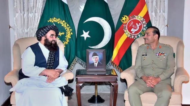 Afghan Foreign Minister Amir Khan Muttaqi, left, meets with Pakistan's Army Chief General Asim Munir,
