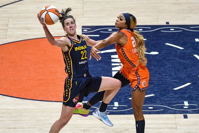 September 22, 2024: Indiana Fever guard Caitlin Clark (22) handles the ball while defended by Connecticut Sun guard/forward DiJonai Carrington (21) during game 1 of the first round of the WNBA playoffs between the Indiana Fever and the Connecticut Sun at Mohegan Sun Arena in Uncasville, Connecticut. Erica Denhoff/CSM (Credit Image: © Erica Denhoff/Cal Sport Media) (Cal Sport Media via AP Images)