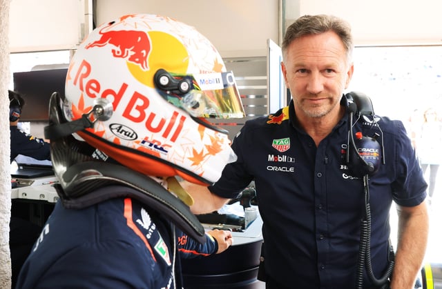Yuki Tsunoda of Japan and Oracle Red Bull Racing talks with Christian Horner, Team Principal of Oracle Red Bull Racing in the garage during qualifying ahead of the F1 Grand Prix of Canada at Circuit Gilles-Villeneuve on June 14, 2025 in Montreal, Quebec.