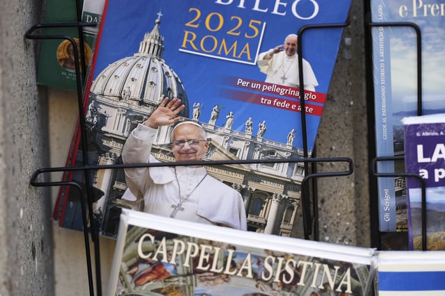 A guide book with an image of Pope Leo XIV on its cover is on display outside a souvenir shop in the town of Castel Gandolfo, a historic summer retreat for popes about 30 kilometers southeast of Rome, where Pope Leo XIV will be spending a short period of rest, is seen Wednesday, July 2, 2025. (AP Photo/Andrew Medichini)