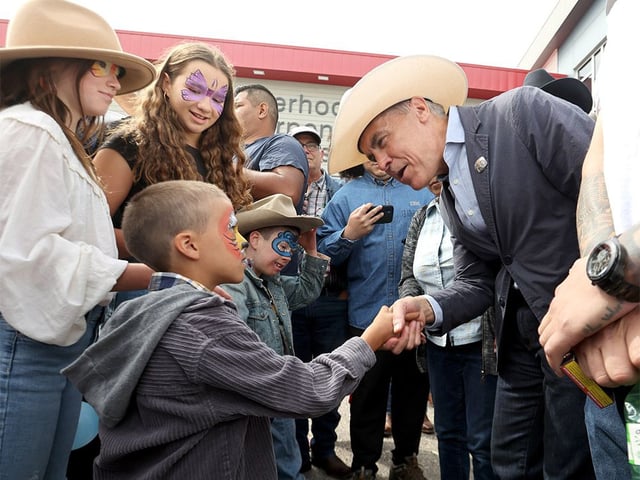  Prime Minister Mark Carney greets people during a Stampede breakfast at the United Brotherhood of Carpenters and Joiners of America in Calgary on Friday, July 4, 2025.