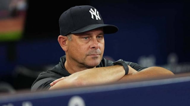 Jul 1, 2025; Toronto, Ontario, CAN; New York Yankees manager Aaron Boone (17) watches batting practice before a game against the Toronto Blue Jays at Rogers Centre. Mandatory Credit: Nick Turchiaro-Imagn Images