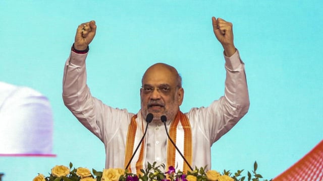 Union minister Amit Shah addresses a gathering during an event to mark the fourth foundation day of the Ministry of Cooperation and the 150th birth anniversary year of Sardar Vallabhbhai Patel, at the campus of Amul Dairy in Anand, Gujarat, Sunday. (PTI)