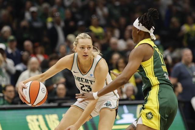 Marine Johannes #23 of the New York Liberty dribbles against Erica Wheeler #17 of the Seattle Storm during the game at Climate Pledge Arena on June 22, 2025 in Seattle, Washington. The Seattle Storm won 89-79.