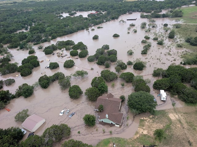 Houses and cars are partially submerged in flood waters in an aerial view near Kerrville, Texas, U.S. July 4, 2025.  U.S. Coast Guard/Handout via REUTERS. 
THIS IMAGE HAS BEEN SUPPLIED BY A THIRD PARTY