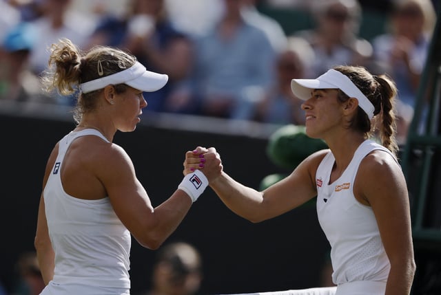 Tennis - Wimbledon - All England Lawn Tennis and Croquet Club, London, Britain - July 6, 2025 Germany's Laura Siegemund shakes hands with Argentina's Solana Sierra after winning her round of 16 match REUTERS/Stephanie Lecocq
