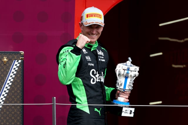Third placed Nico Hulkenberg of Germany and Stake F1 Team Kick Sauber on the podium with his trophy during the F1 Grand Prix of Great Britain at Silverstone Circuit on July 06, 2025 in Northampton, England.