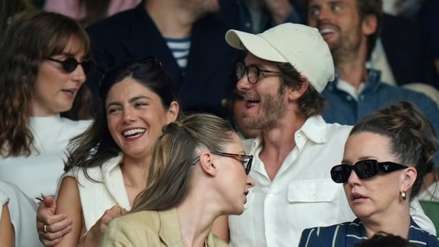 Andrew Garfield and Monica Barbaro were spotted at Wimbledon, sparking dating rumors. (AP Photo/Alastair Grant)