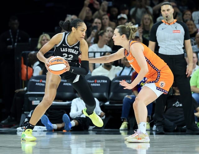 A&#39;ja Wilson #22 of the Las Vegas Aces is guarded by Haley Peters #7 of the Connecticut Sun in the second quarter of their game at Michelob ULTRA Arena on June 25, 2025 in Las Vegas, Nevada. The Aces defeated the Sun 85-59.