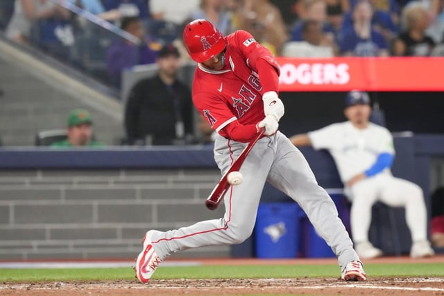 Angels’ Taylor Ward hits an RBI single off Toronto Blue Jays pitcher Kevin Gausman during fifth-inning baseball game action in Toronto, Sunday, July 6, 2025. (Chris Young/The Canadian Press via AP)