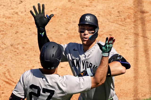 New York Yankees&#39; Aaron Judge, right, is congratulated by Giancarlo Stanton, left, after hitting a two-run home run during the fifth inning of a baseball game against the New York Mets, Sunday, July 6, 2025, in New York. (AP Photo/Adam Hunger)