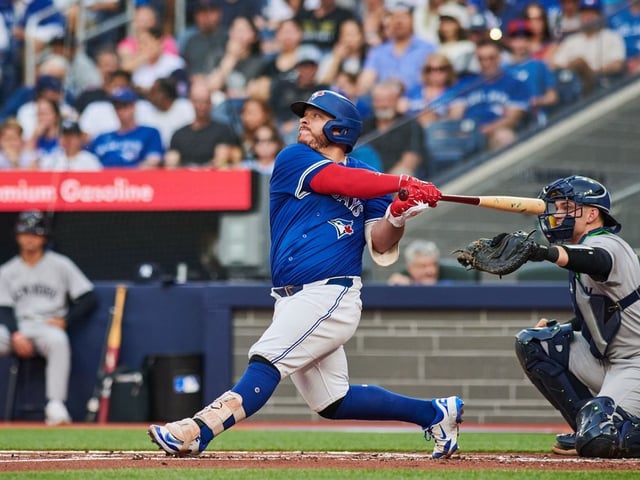 Toronto Blue Jays catcher Alejandro Kirk (30) hits a two RBI double against New York Yankees pitcher Will Warren (98) during first inning MLB baseball action in Toronto, on Wednesday, July 2, 2025.