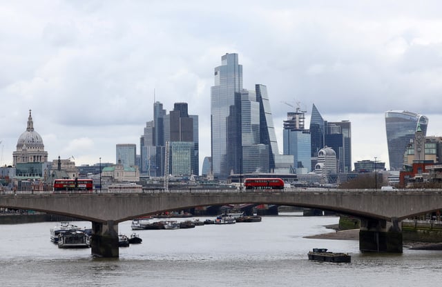 Buses cross Waterloo Bridge with the City of London financial district seen behind, in London, Britain, March 5, 2024. REUTERS/Toby Melville/File Photo