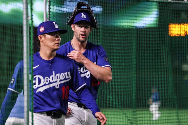 Tokyo, Japan, Saturday, March 15, 2025 – Clayton Kershaw, right, chats with fellow pitcher Yoshinobu Yamamoto before The LA Dodgers play an exhibition game against the Yomiuri Giants at the Tokyo Dome for the MLB Tokyo Series 2025. (Robert Gauthier/Los Angeles Times via Getty Images)