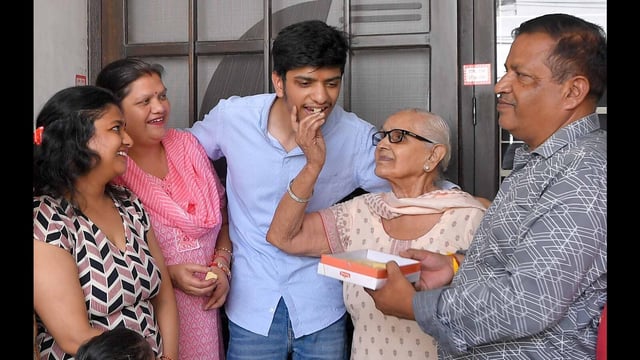 Madhur Goyal celebrating his feat with his family in Ludhiana on Sunday. (Manish/HT)