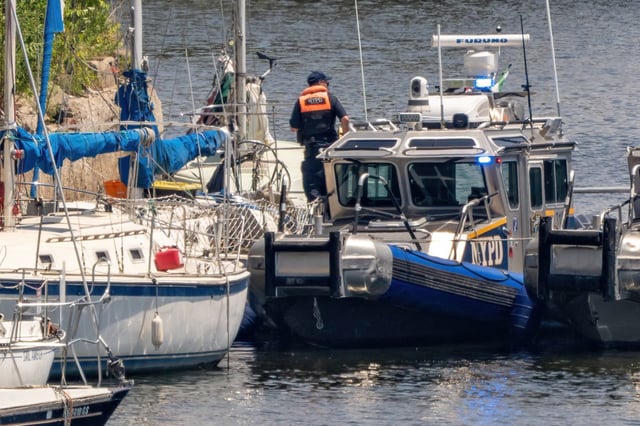 FDNY personnel discovered a badly decomposed body on board a boat docked in Newtown Creek near the Pulaski Bridge in Queens on Sunday July 6, 2025. 1325. (Theodore Parisienne / New York Daily News)