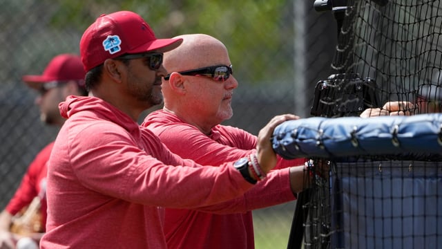 Washington Nationals manager Dave Martinez, left, watches with general manager Mike Rizzo during spring training baseball practice. (AP Photo/Jeff Roberson, File)