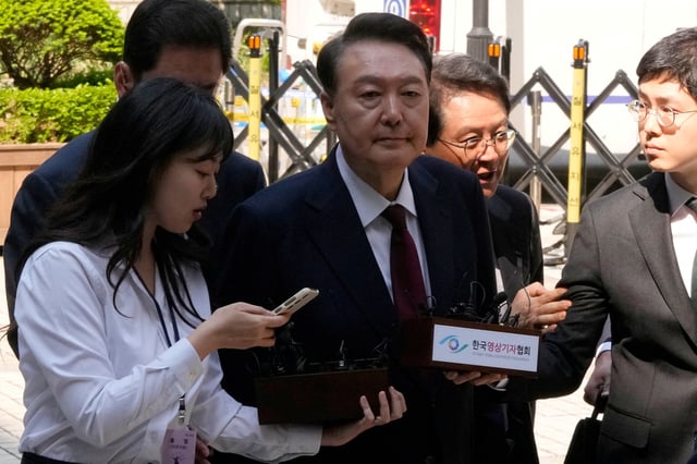 South Korea's ousted President Yoon Suk Yeol, who is facing charges of orchestrating a rebellion when he declared martial law, arrives to attend his  trial at the Seoul Central District Court in Seoul, South Korea, Monday, May 12, 2025.     Ahn Young-joon/Pool via REUTERS/File Photo