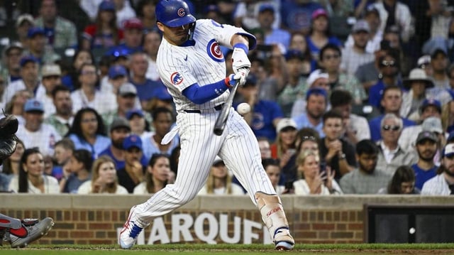 Jul 6, 2025; Chicago, Illinois, USA;  Chicago Cubs outfielder Seiya Suzuki (27) hits an RBI double against the St. Louis Cardinals during the third inning at Wrigley Field. Mandatory Credit: Matt Marton-Imagn Images