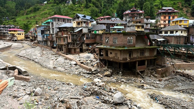 Debris and silt near damaged houses at a flood-affected area, in Mandi district, as Himachal Pradesh continues to witness heavy rains.
