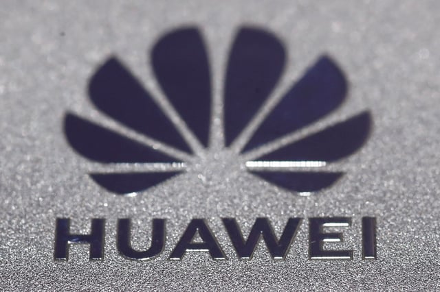 Huawei logo is seen during Munich Auto Show, IAA Mobility 2021 in Munich, Germany, September 8, 2021. REUTERS/Wolfgang Rattay/File Photo