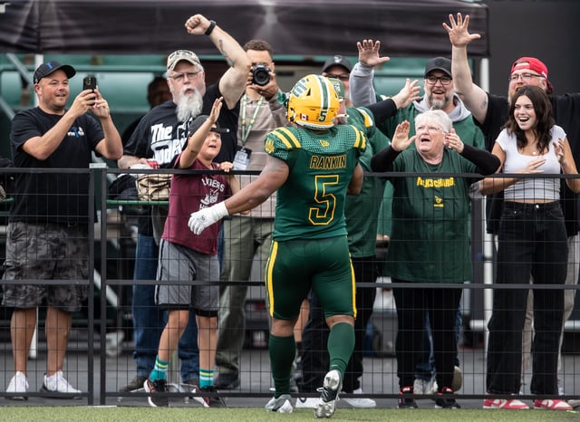 Edmonton Elks' Justin Rankin (5) celebrates a touchdown with fans against the Ottawa Redblacks during second half CFL action in Edmonton, on Sunday July 6, 2025.