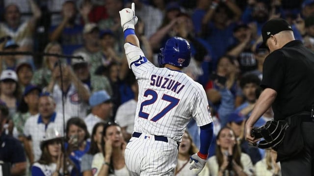 Jul 6, 2025; Chicago, Illinois, USA;  Chicago Cubs outfielder Seiya Suzuki (27) points after hitting a home run against the St. Louis Cardinals during the fifth inning at Wrigley Field. Mandatory Credit: Matt Marton-Imagn Images